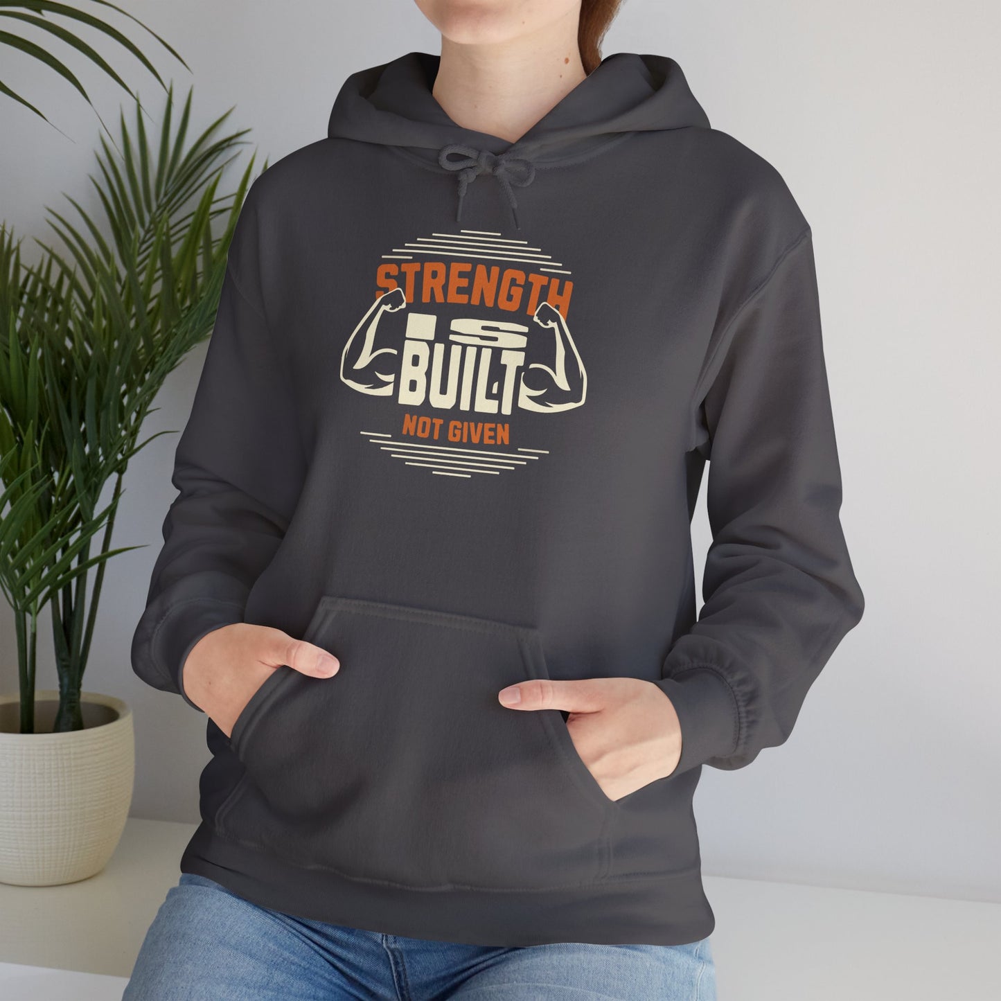 unisex heavy blend™ hooded sweatshirt - strength is built not given - motivational gym quote