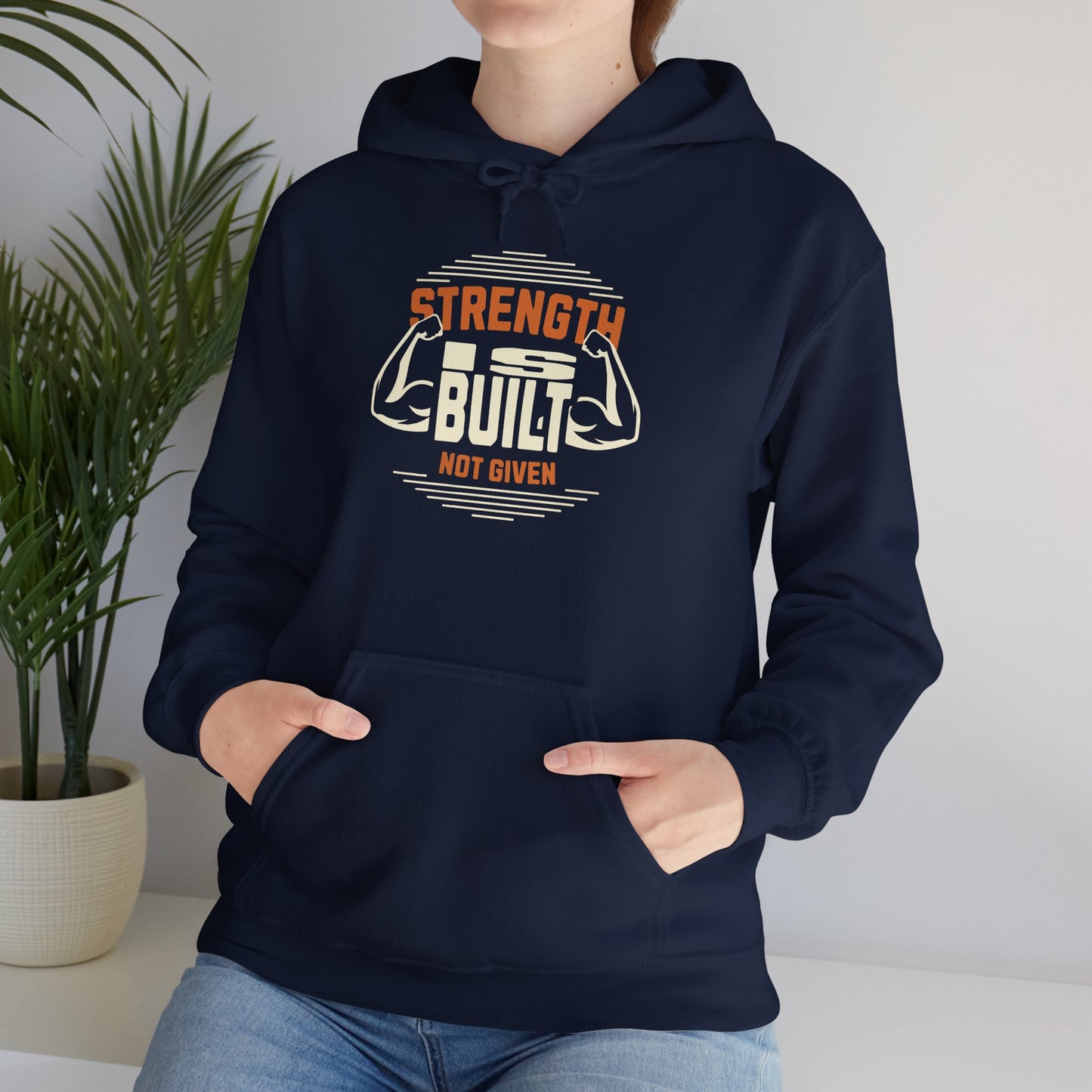 unisex heavy blend™ hooded sweatshirt - strength is built not given - motivational gym quote